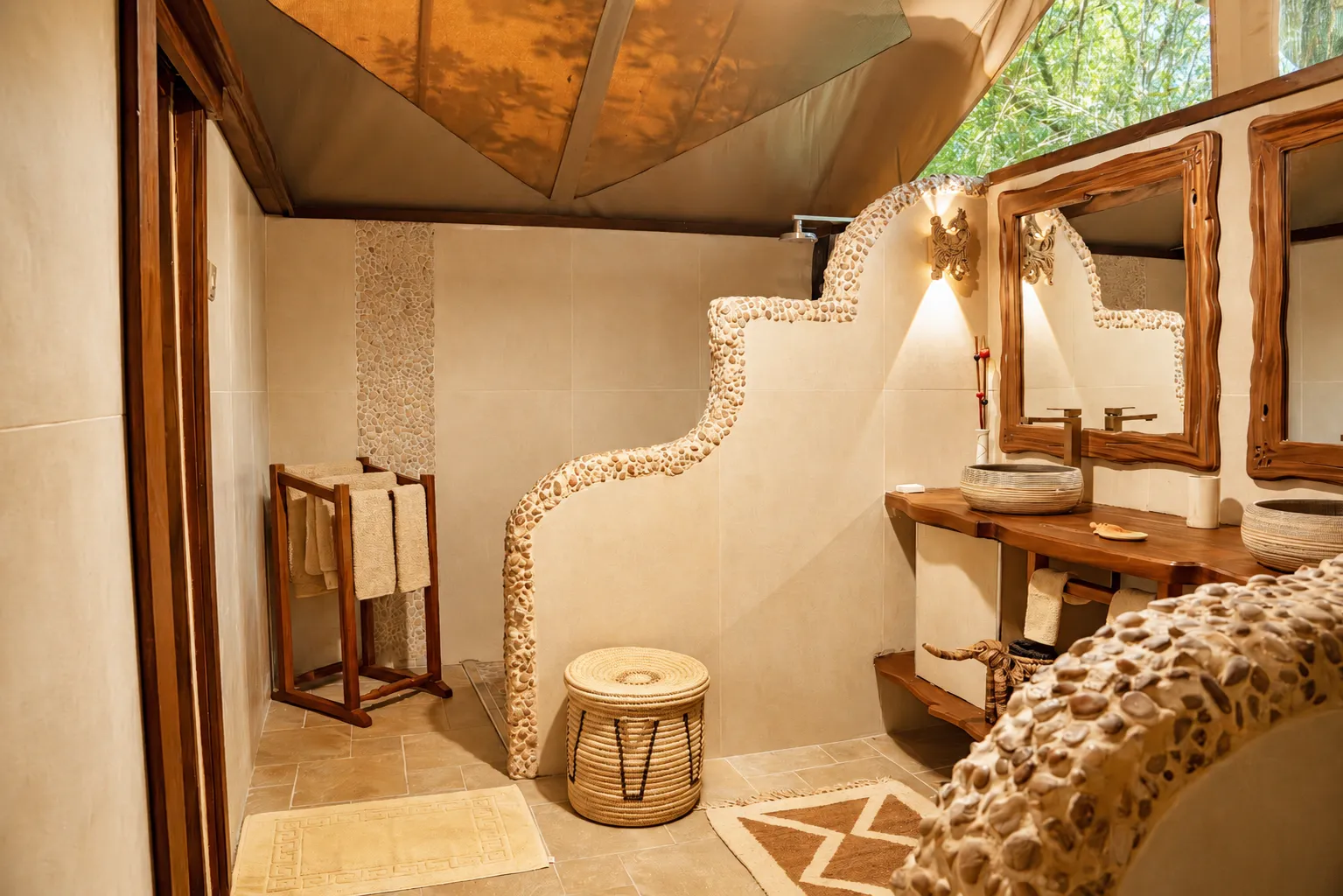 Luxury stone-tiled en-suite bathroom inside a private bush tent at Exploreans Mara River Camp, Kenya