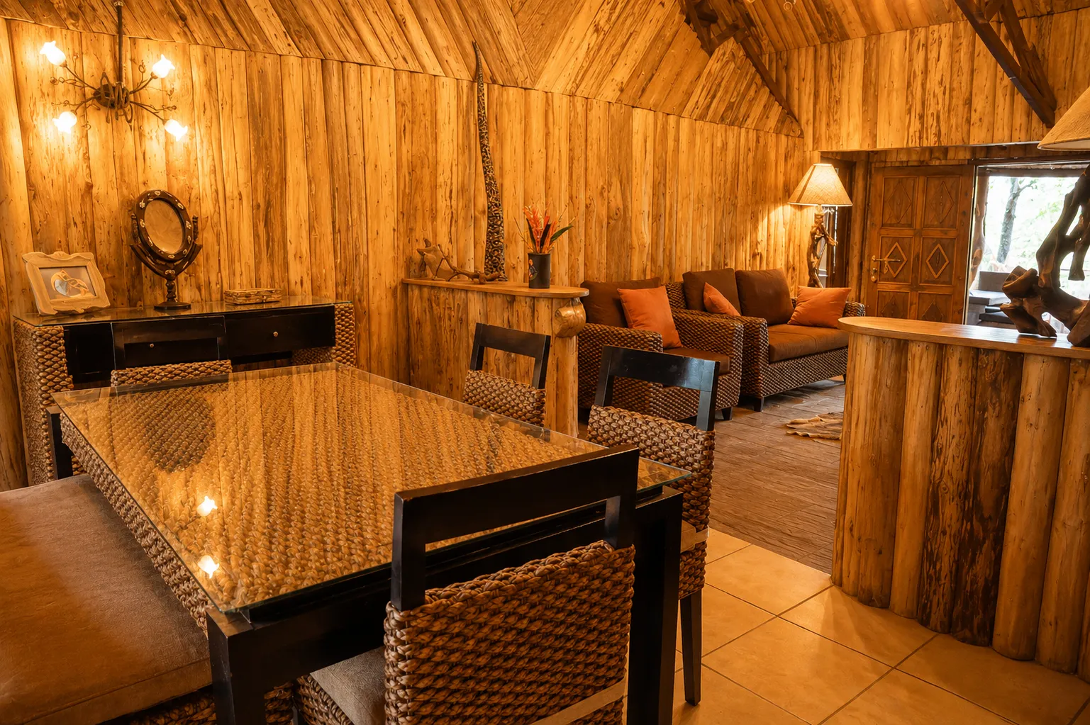 Spacious dining table and private living room area inside the family safari chalet at Exploreans Mara River Camp, Masai Mara, Kenya