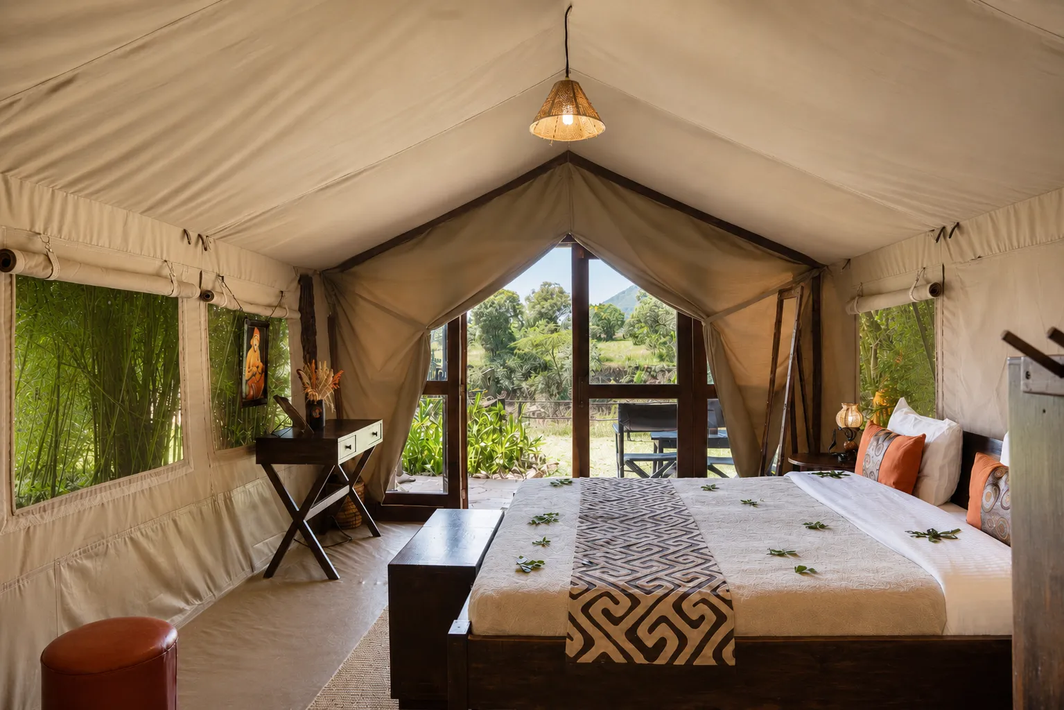 Luxury riverfront tent with view over the Mara river, in Masai Mara, Kenya. At Exploreans Mara River Camp exclusive safari lodge