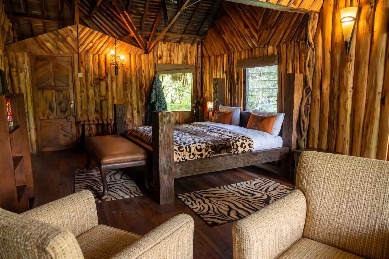 Simba's Den two-bedroom log cabin with river-view deck at Exploreans Mara River Camp, Maasai Mara Kenya